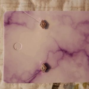 Small gold diamond shaped stud earrings